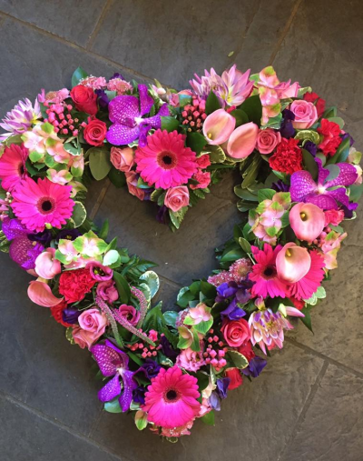Heart SYM-325 - A beautiful open heart made with a selection of pink flowers specially chosen to make a stunning tribute by our florists. Heart SYM-325 - A beautiful open heart made with a selection of pink flowers specially chosen to make a stunning tribute by our florists.